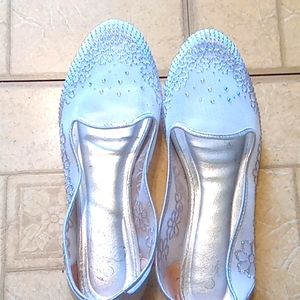 Silver dress shoe.